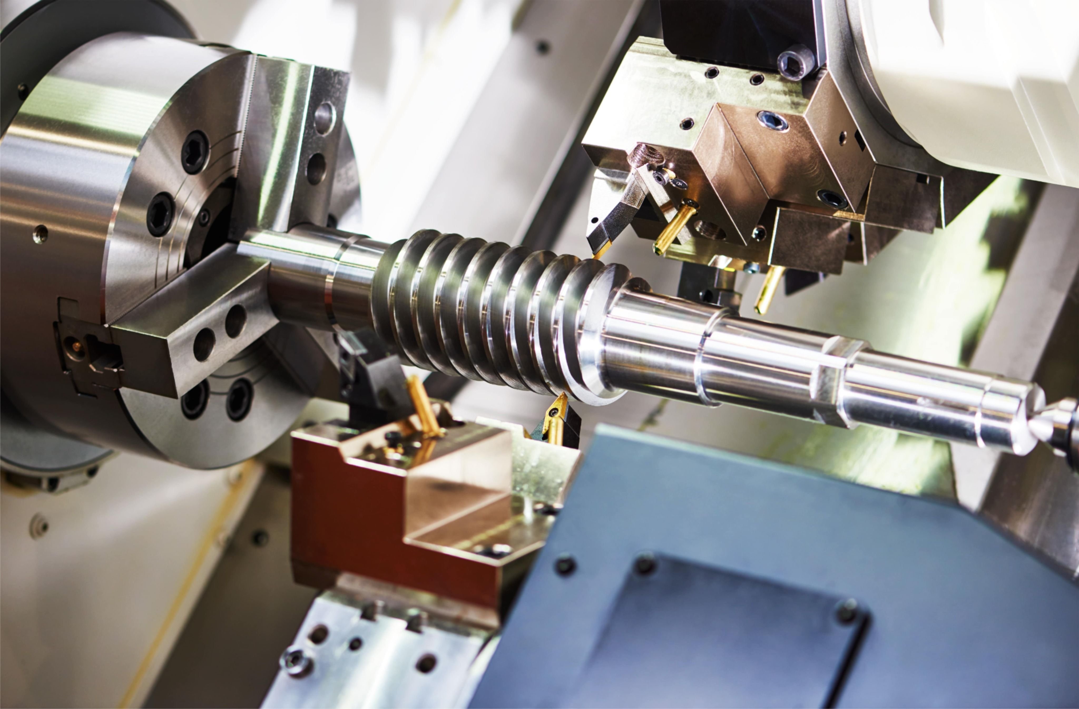Machinist measuring a soft machined part with a micrometer during the pre-hardening stage